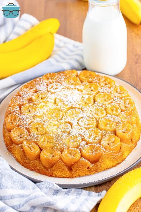 A serving plate with a beautiful banana upside down cake.