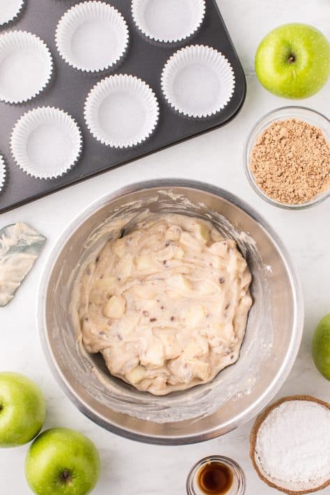 Apple streusel muffin mix in a mixing bowl.