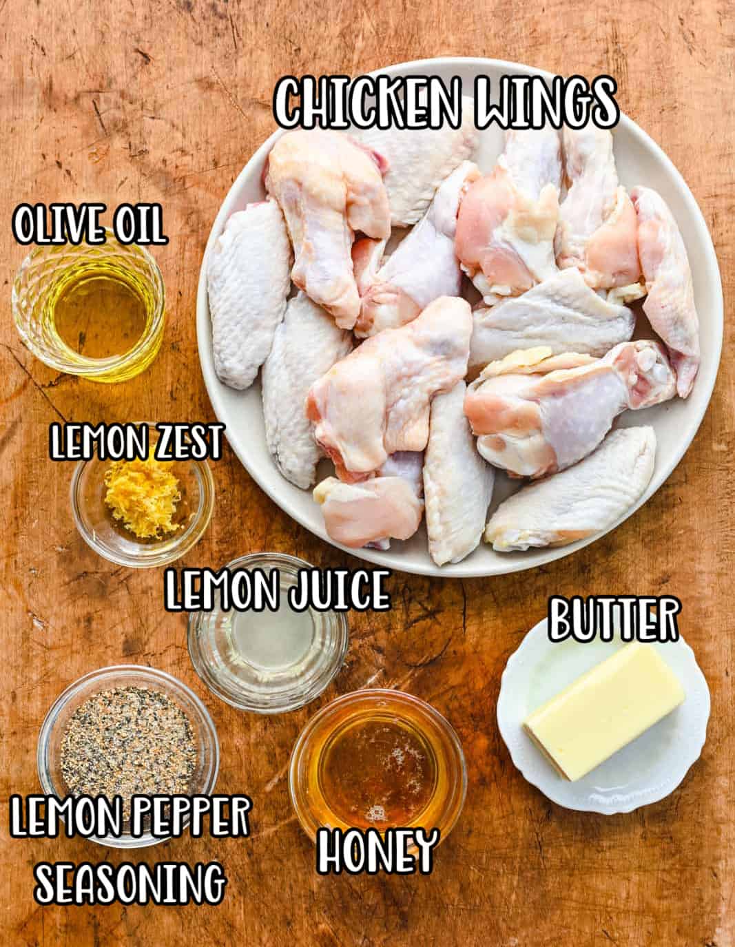 Chicken wings, lemon pepper seasoning, butter, olive oil, honey, lemon juice, and lemon zest.