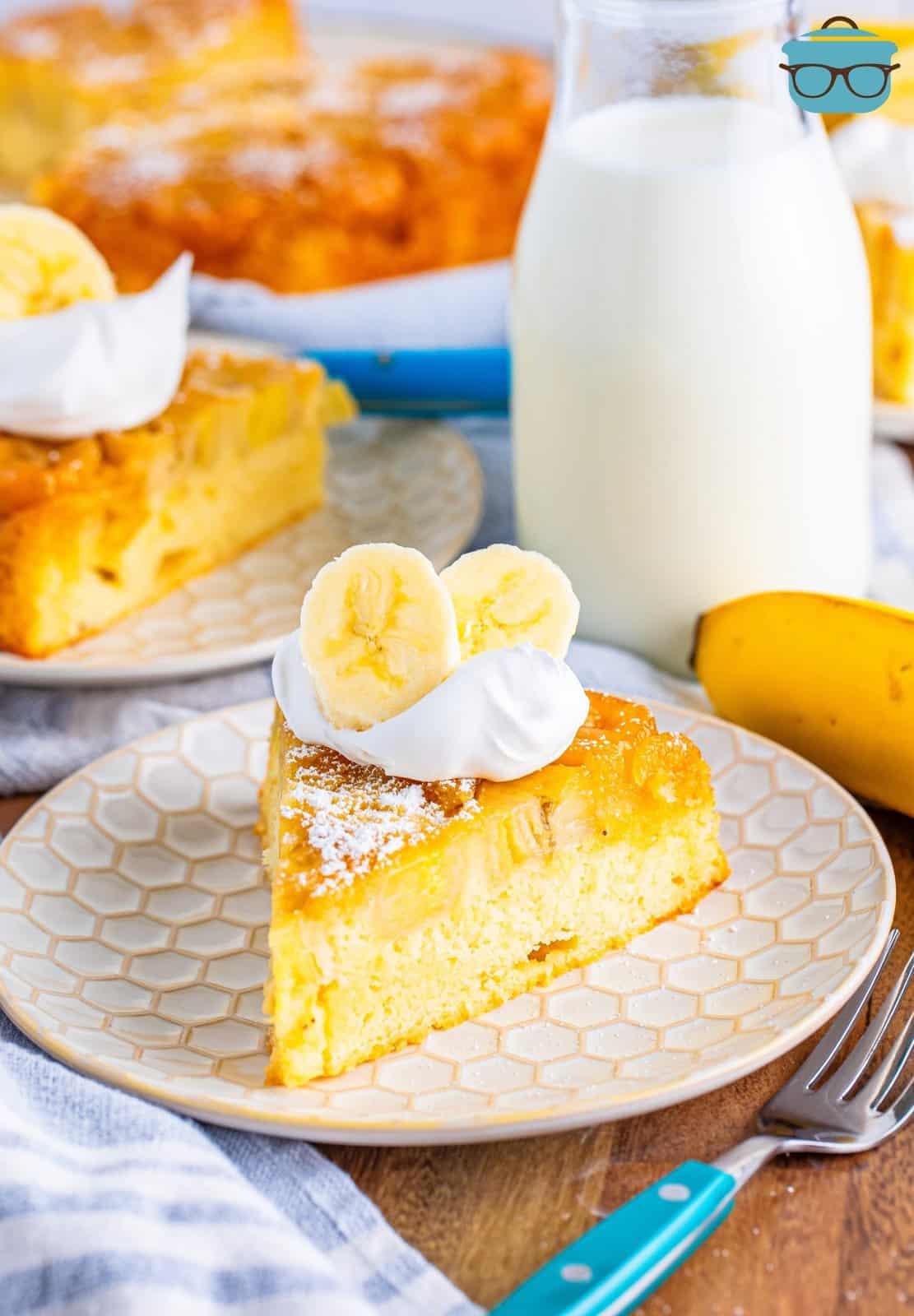 A slice of banana upside down cake on a plate.