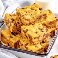 A pile of a few Peanut Butter Chocolate Chip Cookie Bars.