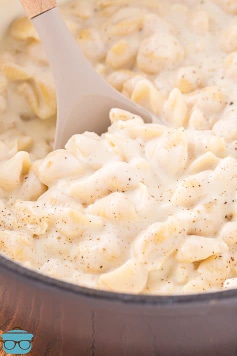 Close up looking at a pot of white cheddar mac and cheese.