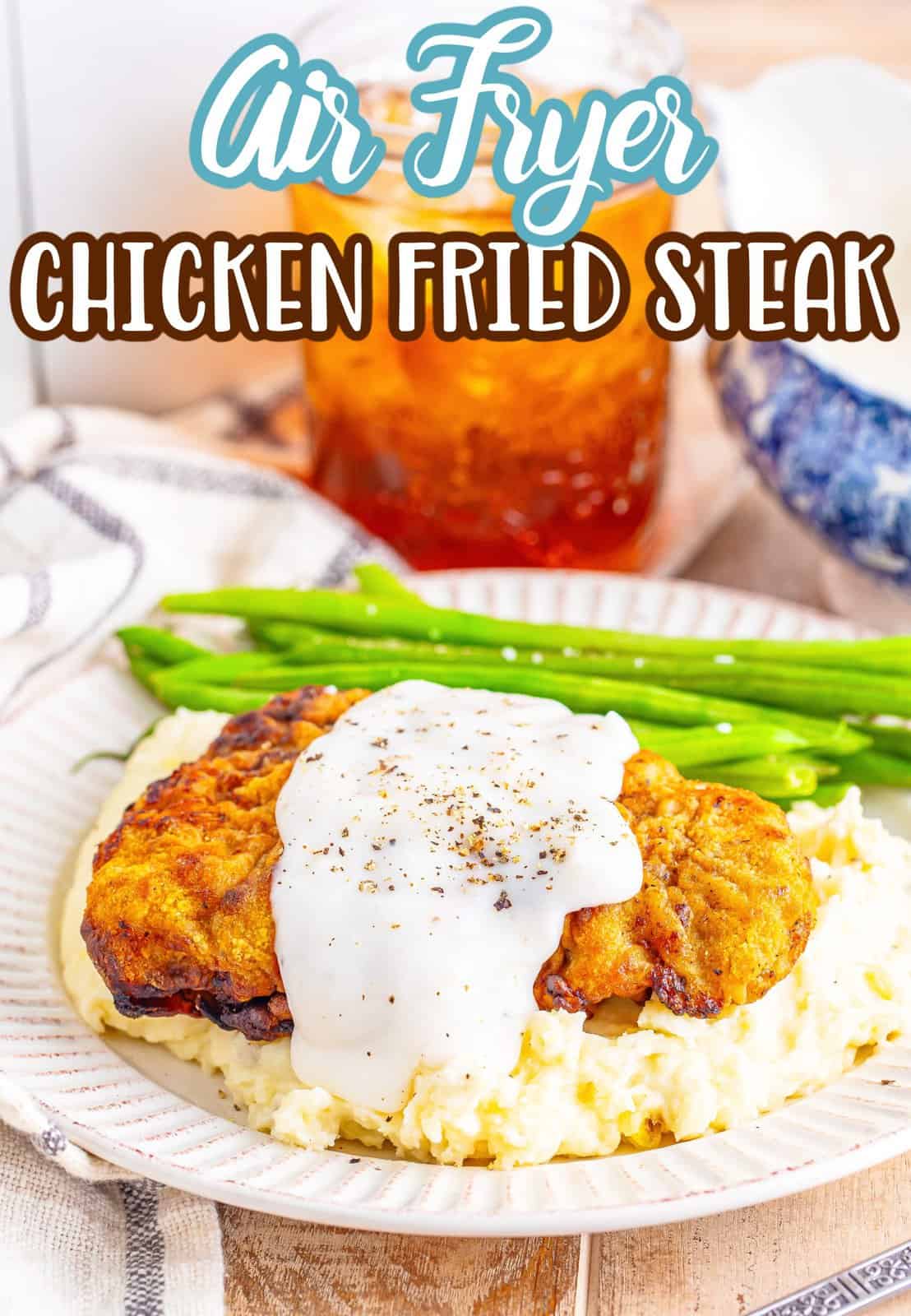 Chicken fried steak made in the Air Fryer on a plate with sides.