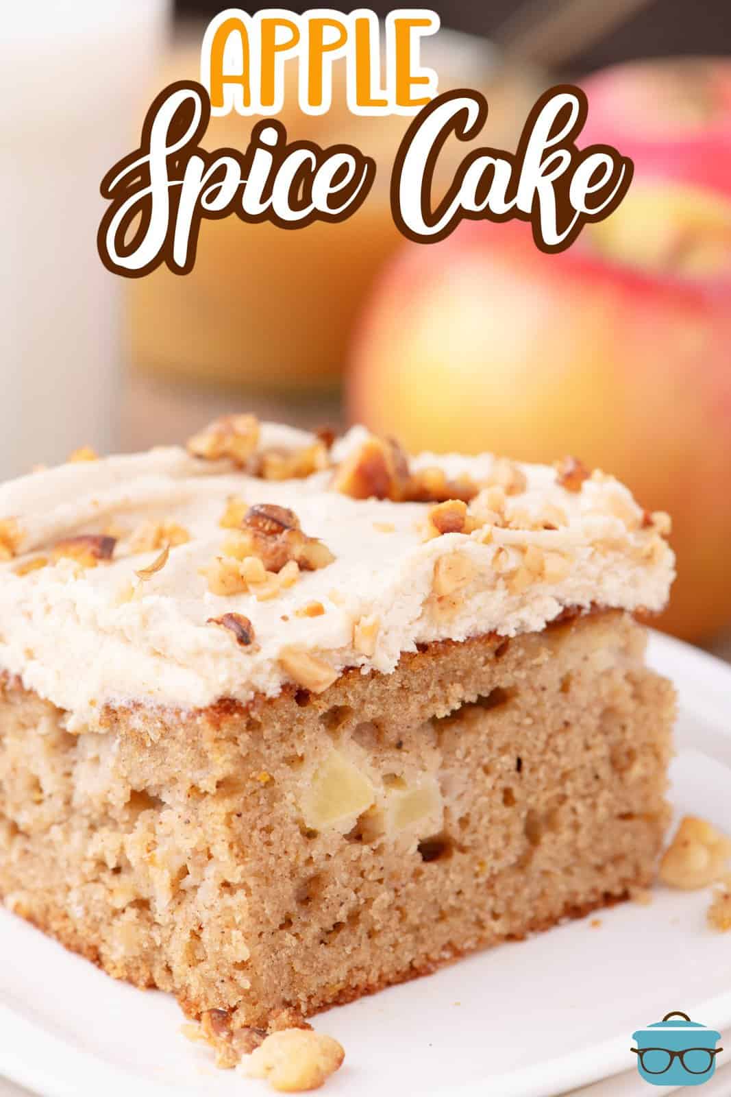 A slice of homemade Apple Spice Cake with homemade brown sugar frosting and nuts on top.