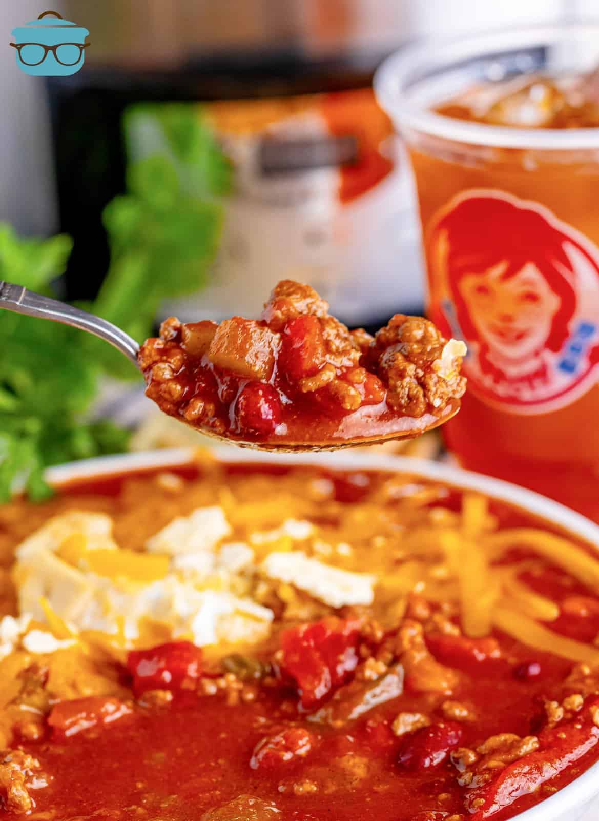A spoon holding a bite of homemade Wendy's Chili.