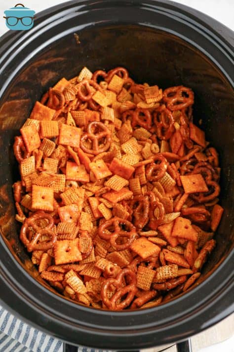 A crock pot insert filled with Buffalo Ranch Chex Mix.
