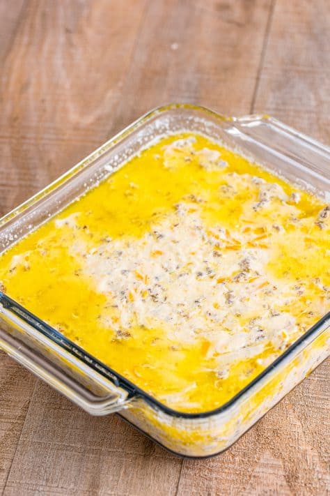 Biscuit dough in melted butter in a baking dish.