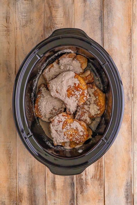 Crock pot with pork chops and au jus gravy mix.