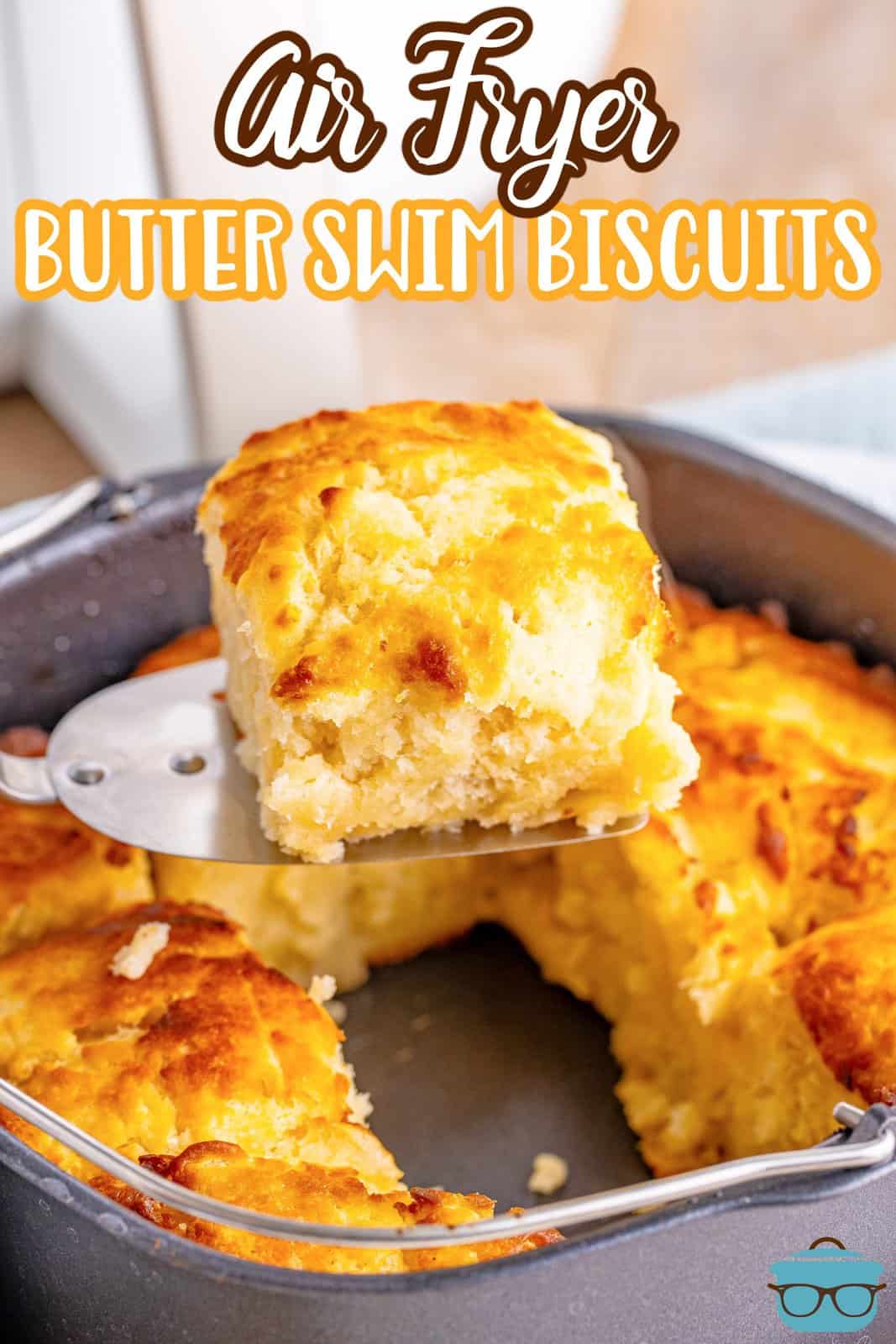 A fresh made Butter Swim biscuit above the Air Fryer basket.