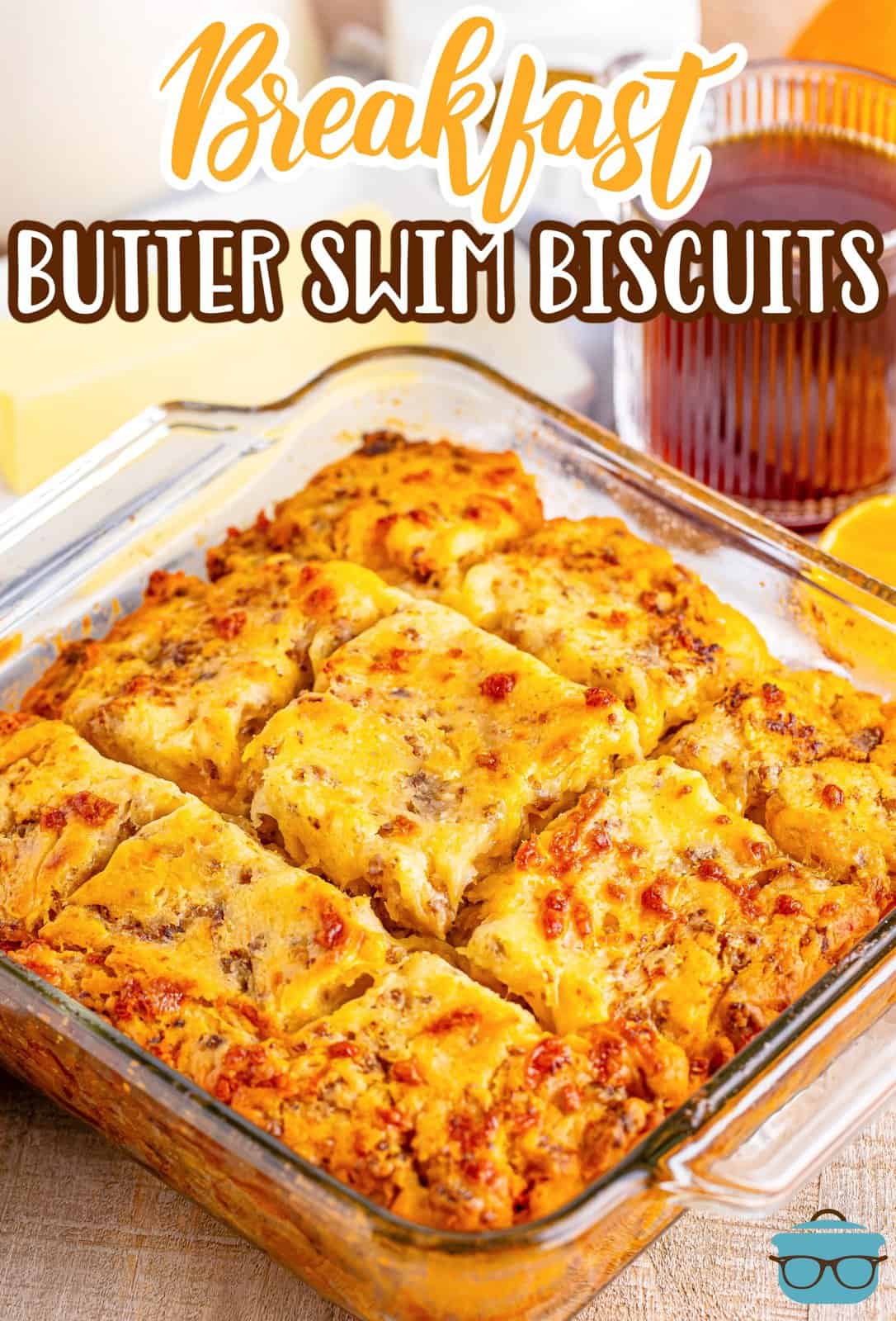 A baking dish with Breakfast Butter Swim Biscuits cut into squares.