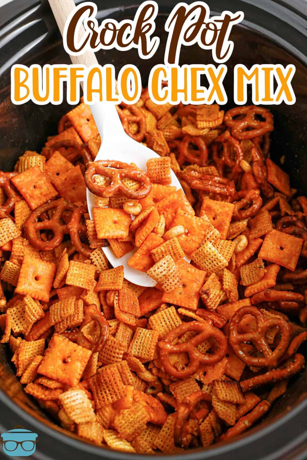 A serving spoon getting some Buffalo Ranch Chex Mix.
