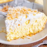 A slice of No Bake Coconut Cream Pie on a plate.