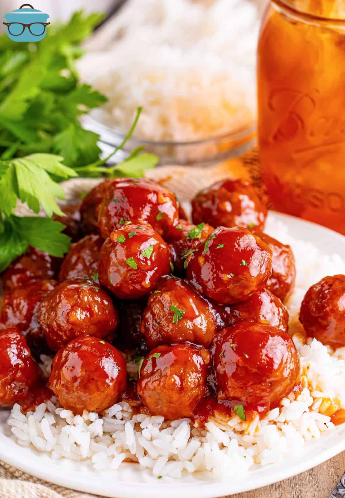A plate of rice and honey garlic meatballs.