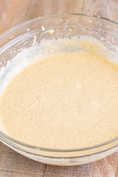Vanilla cake mix in a bowl with apple spice mix.
