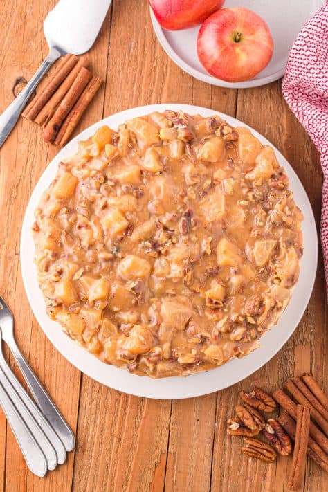 Caramel Apple Topping spread on top of cheesecake.