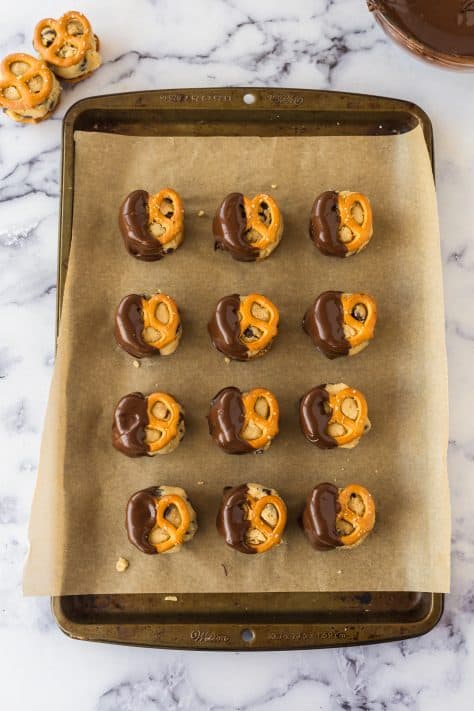 cookie dough pretzel bites dipped in melted chocolate.