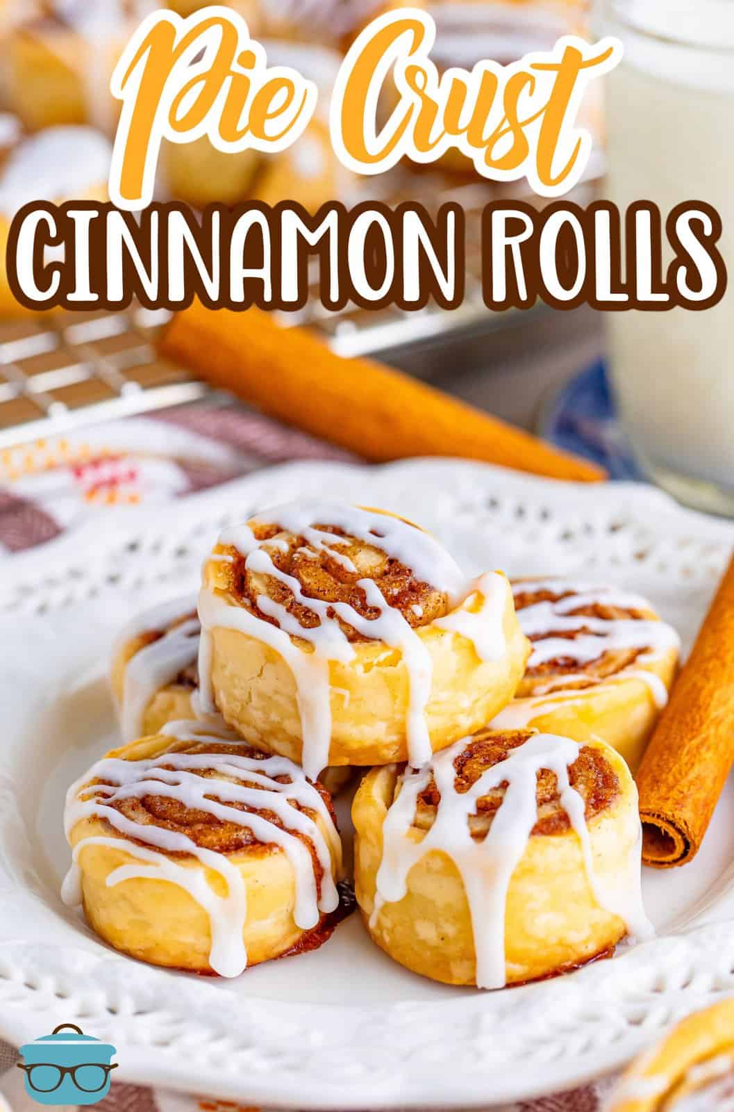 A few cinnamon rolls stacked on a plate.