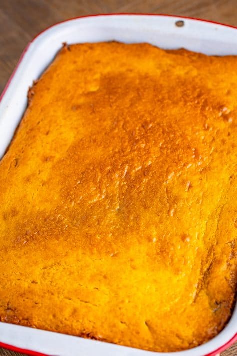 A fresh made pumpkin honey bun cake in a baking dish.