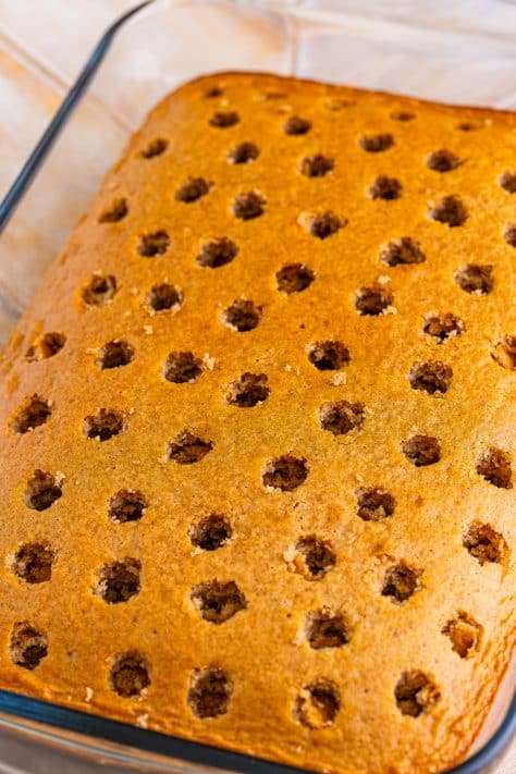 A spice cake with holes poked in it.