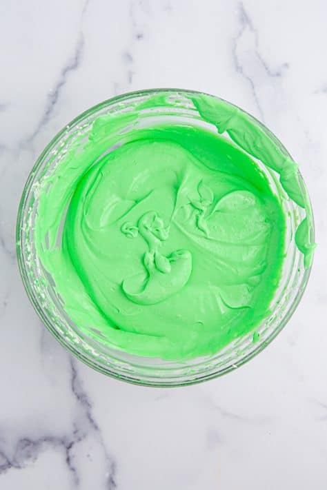 Green pudding in a mixing bowl.