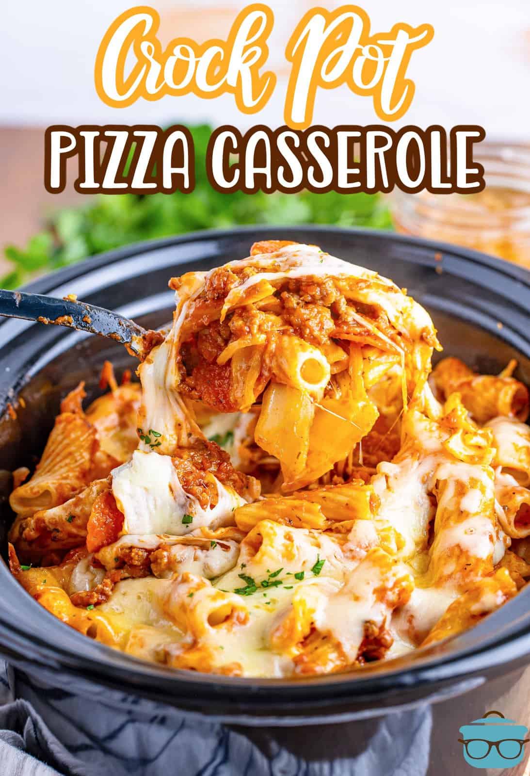 Some Pizza Casserole being removed from the Crock Pot.