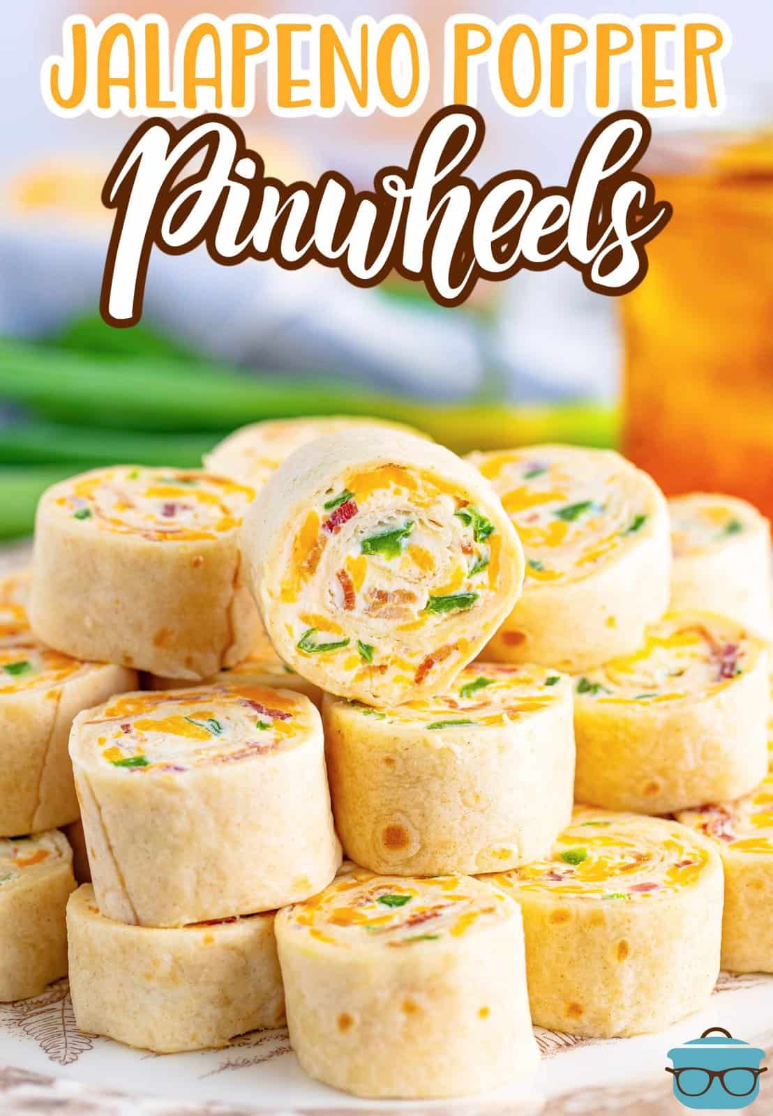Jalapeno Popper Pinwheels in a pile on a plate.