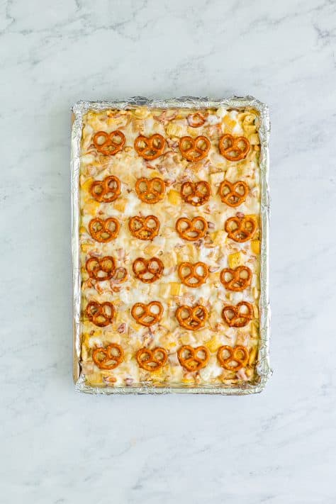 Pretzels on top of these marshmallow treats on a sheet pan.
