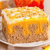 A plate of Pumpkin Poke Cake with perfect fall flavors.