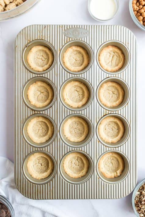 fully cooked sugar cookie dough in a muffin pan.