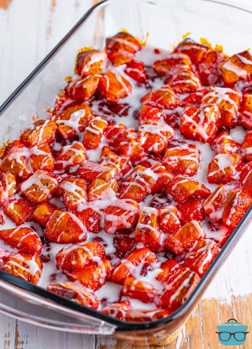 A glazed Cherry Pie Bubble Up in a baking dish.