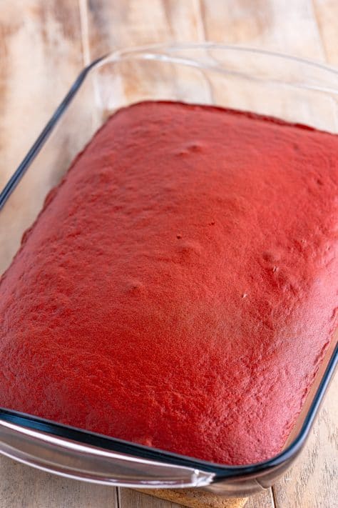 A red velvet cake in a baking dish.