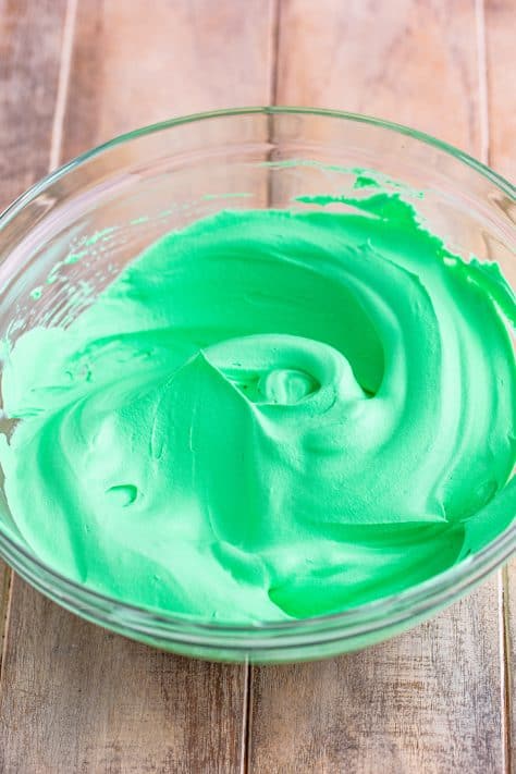 Green whipped topping in a bowl.