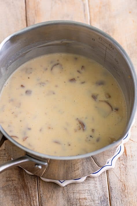 Cream of mushroom soup in a pot.