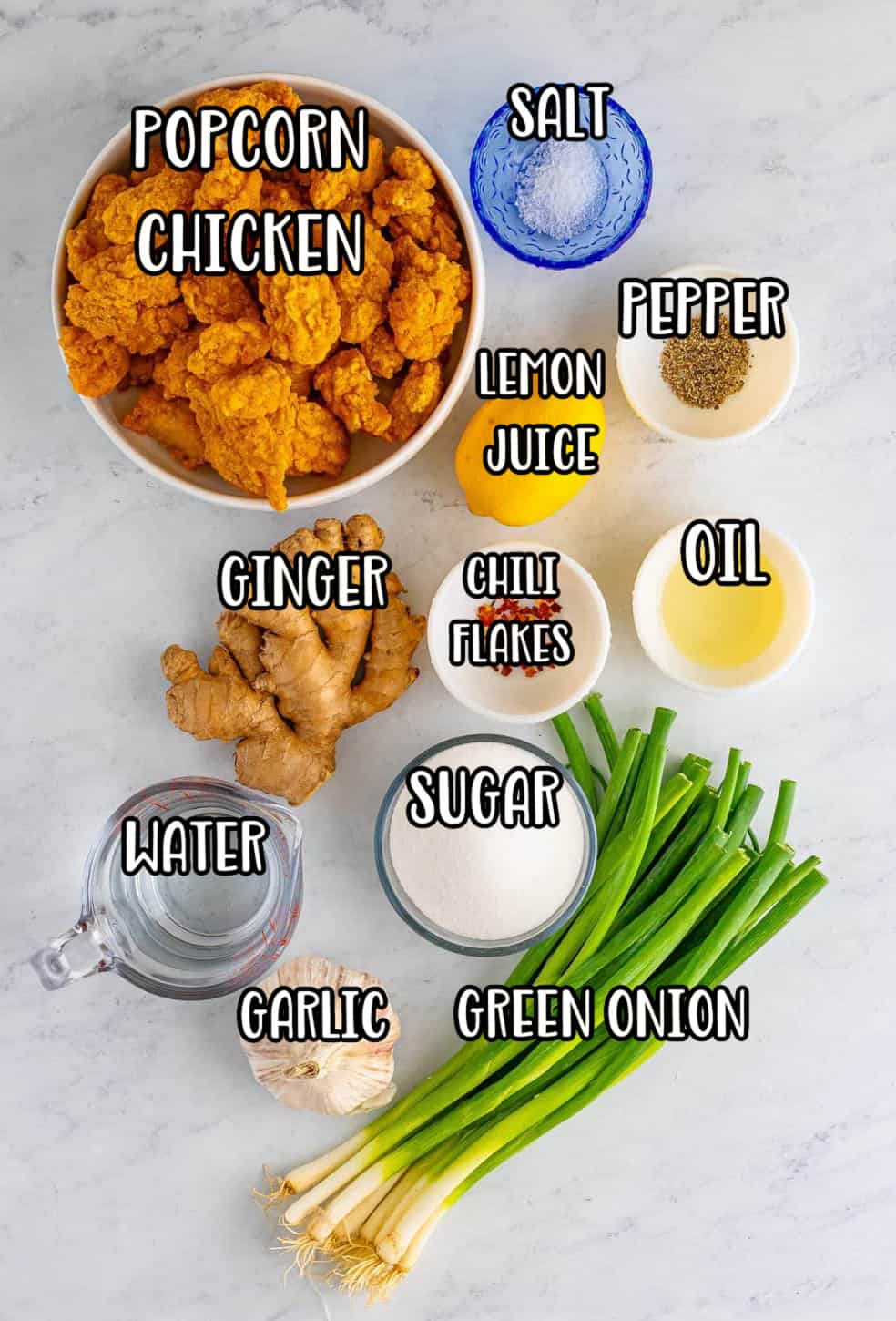 Popcorn chicken, green onion, lemon, kosher salt, black pepper, sugar, water, chili flakes, fresh ginger, fresh garlic, and vegetable oil.