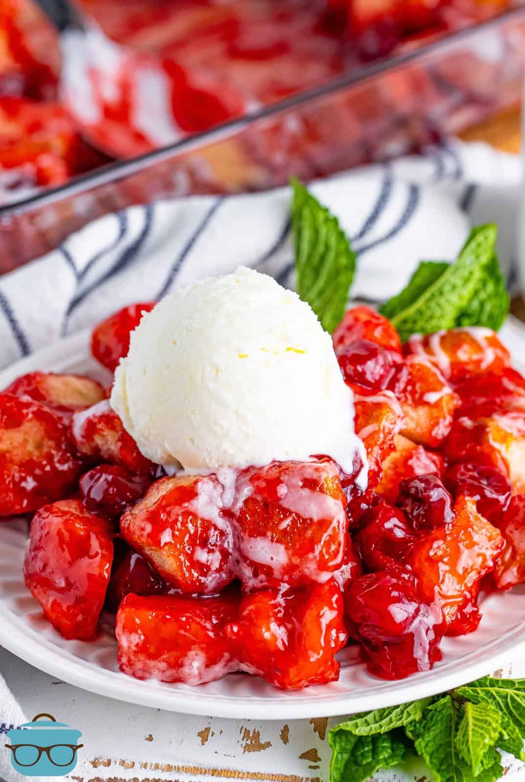 A plate of Cherry Pie Bubble Up with a scoop of ice cream on top.