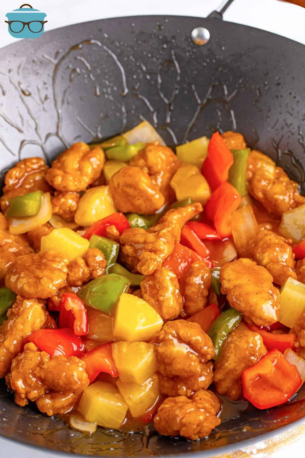 A large skillet with Sweet and Sour Chicen.