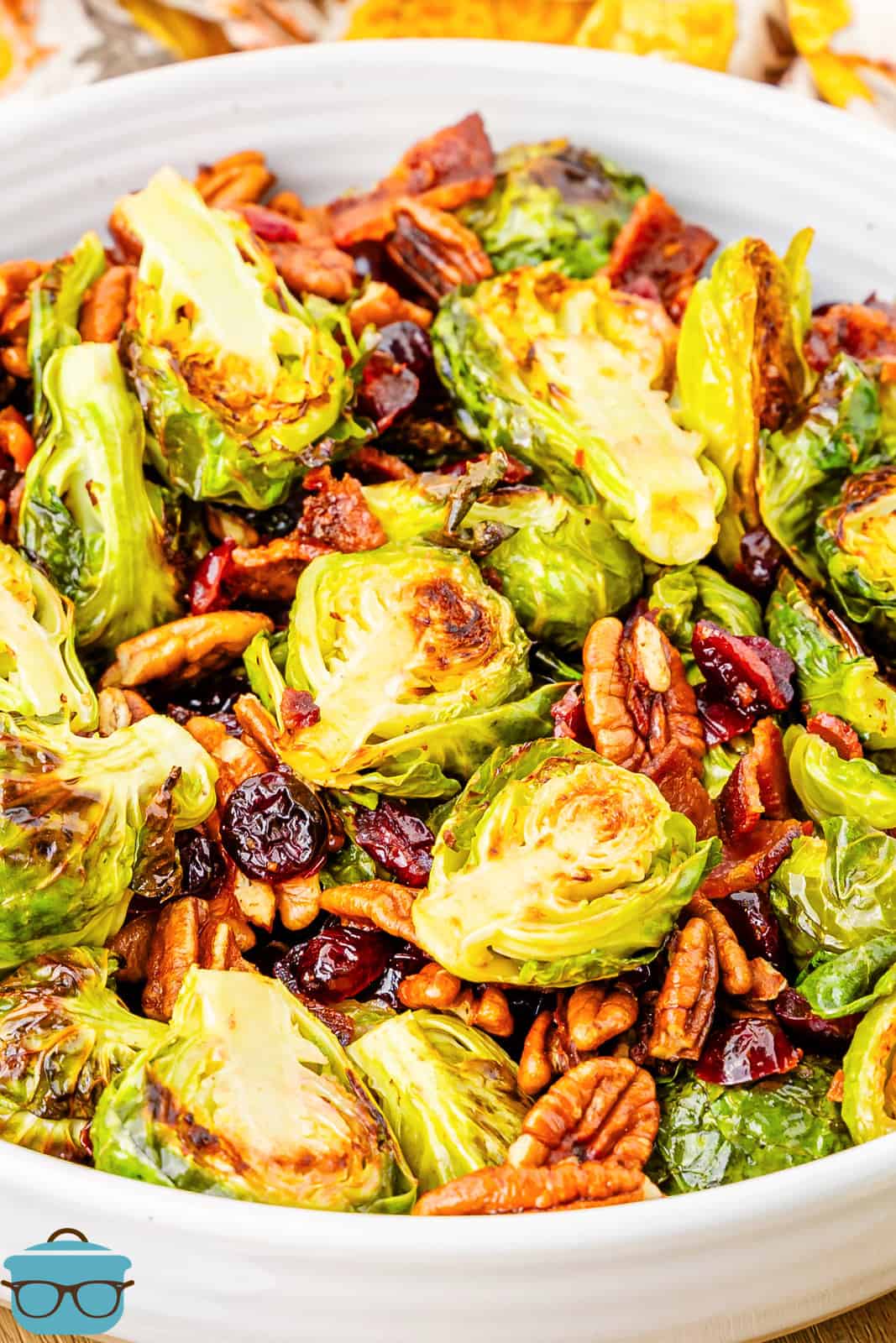A white serving platter of Roasted Brussels Sprouts.