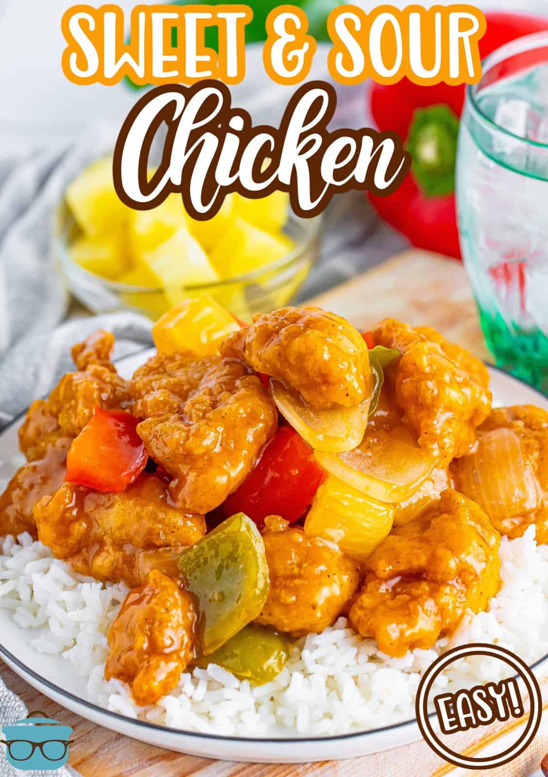 A plate of Sweet and Sour Chicken on top of white rice.