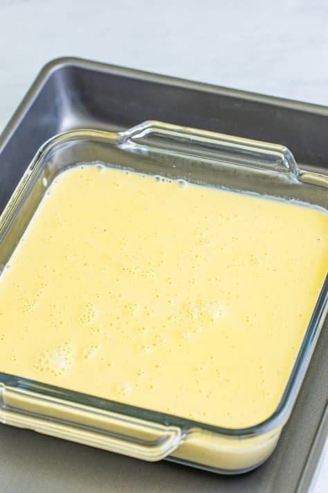 Cream mixture in a glass baking dish.
