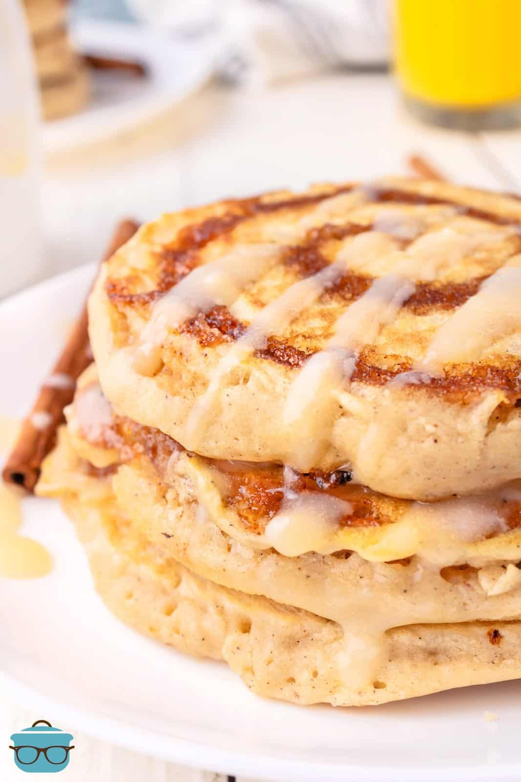 Close up looking at a stack of Cinnamon Roll Pancakes.