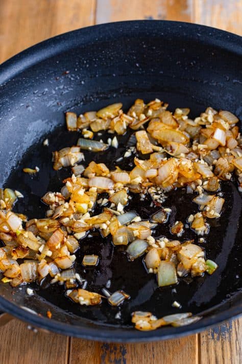 Cooked onion and garlic in a skillet.