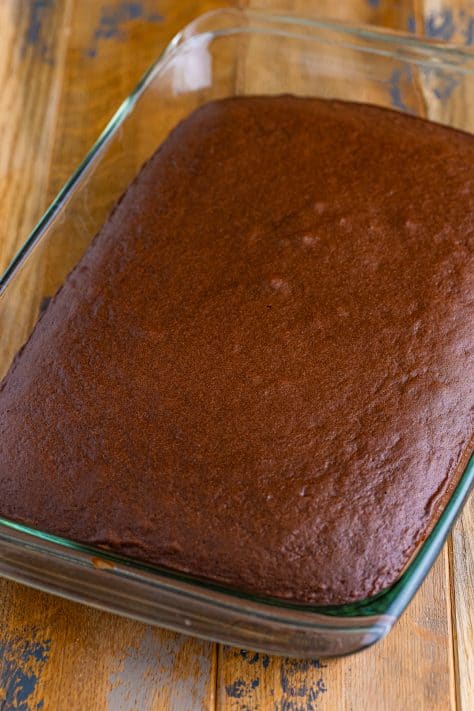 A chocolate cake in a glass baking dish.