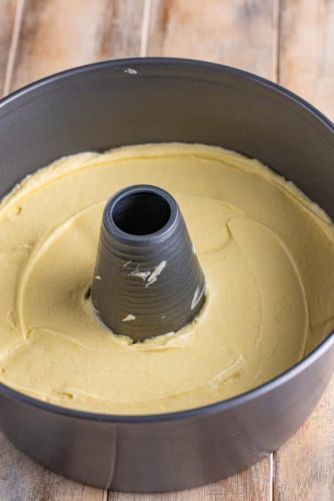 pound cake batter spread into angel food pan.