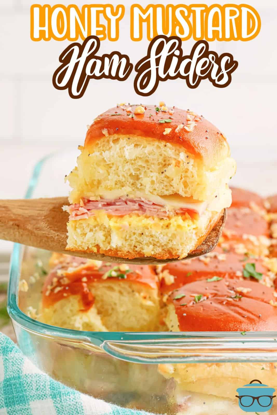 A glass dish with you Honey Mustard Ham Sliders.