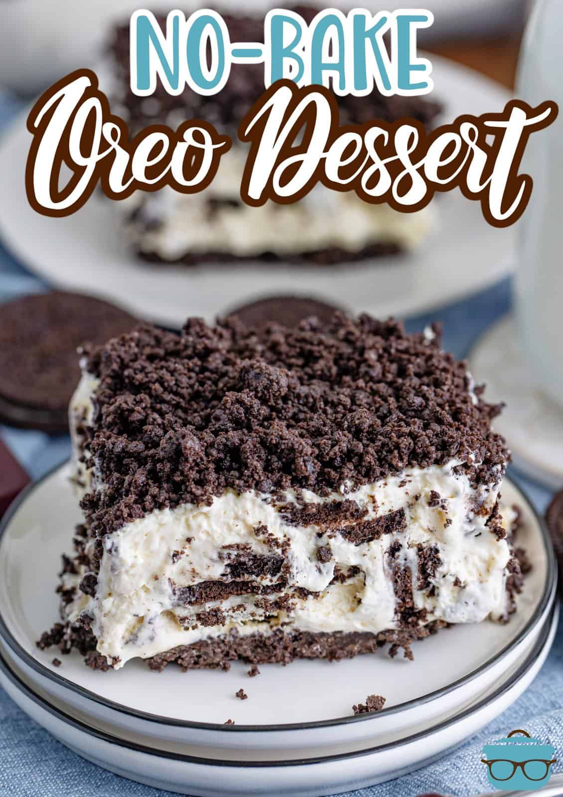 A few plates in a pile with a piece of No Bake Oreo Dessert on the top plate.