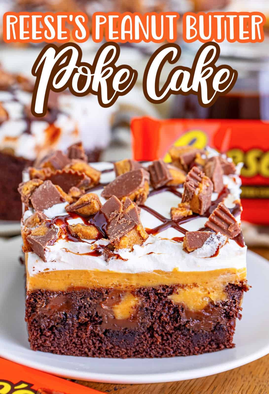 A garnished piece of Peanut Butter Reese's Poke Cake.