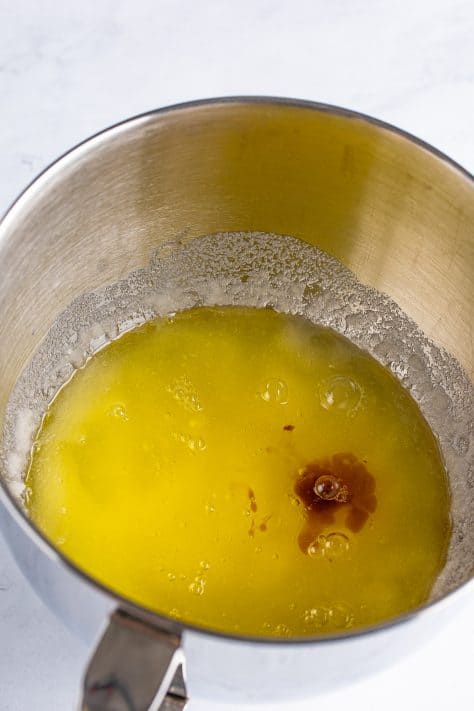 Extracts being added to the egg white, oil, and sugar mixture.
