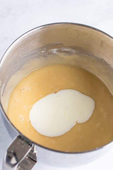 Buttermilk being added to cake batter.