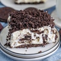 A large slice of No Bake Oreo Dessert on a serving plate.