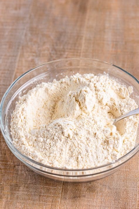 A mixing bowl with flour, Nilla wafer crumbs, and baking soda.